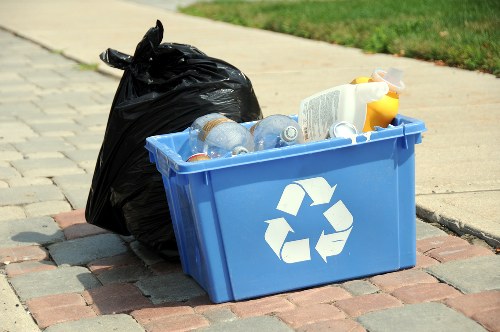 Workers loading garden waste into a truck during a medium garden clearance