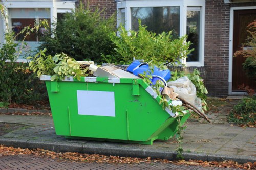 Large pile of cleared garden waste awaiting removal in a suburban Sutton garden